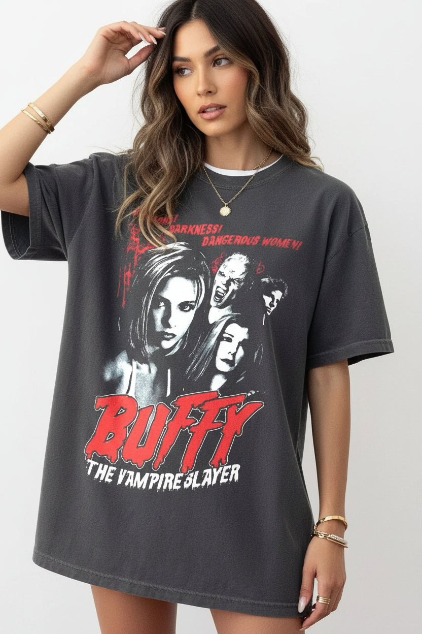 Person wearing a 'Buffy the Vampire Slayer' t-shirt with graphic design.