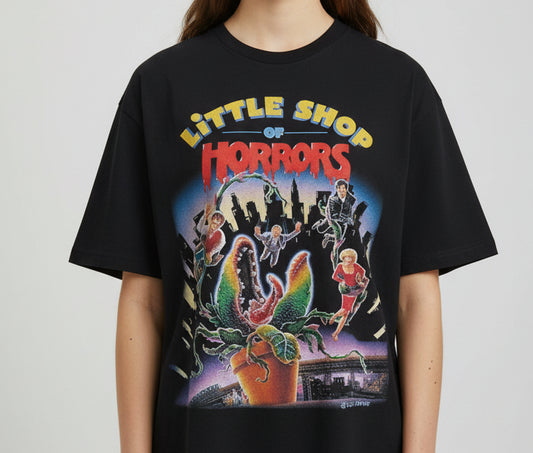 Black t-shirt with 'Little Shop of Horrors' graphic design on a white background